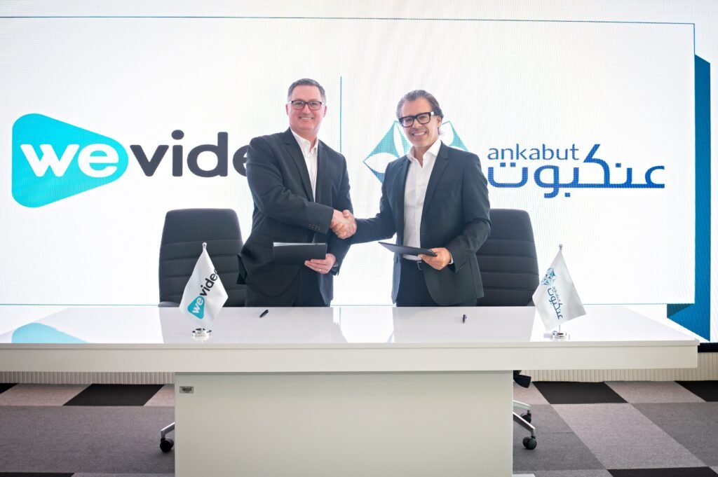 Kevin-Knight-Chief-Executive-Officer-of-WeVideo-and-Tarek-Jundi-Chief-Executive-Officer-of-Ankabut-shaking-hands-after-signing-the-partnership-deal